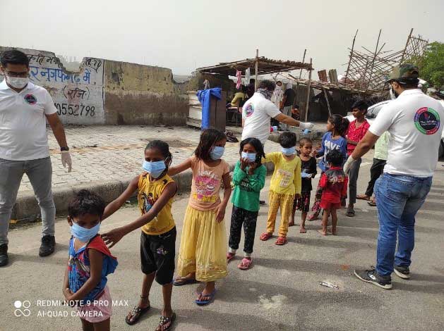 Team HeEdEn In The Slums for Distribution of 500 Food Packets With Water For Needy